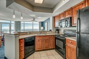 Enjoy cooking in this well-equipped kitchen with a large island, oven, and dishwasher.
