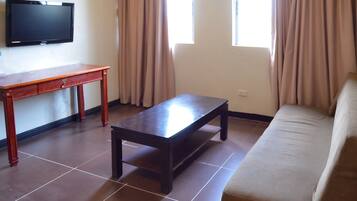 Family Studio | Living area | 32-inch flat-screen TV with cable channels, TV