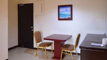 Deluxe Double Room | Living area | 32-inch flat-screen TV with cable channels, TV