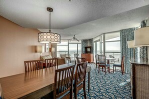 Relax in this spacious room with a dining area, seating area, and ocean-view balcony.