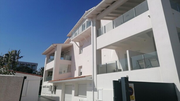 A multi-story building with balconies, large windows, and a clear sky. - LOVELY GROUND-FLOOR APARTMENT FOR 6/8 PINK PEOPLE (Roses)