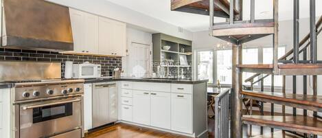 Microwave, dishwasher, coffee/tea maker, cookware/dishes/utensils