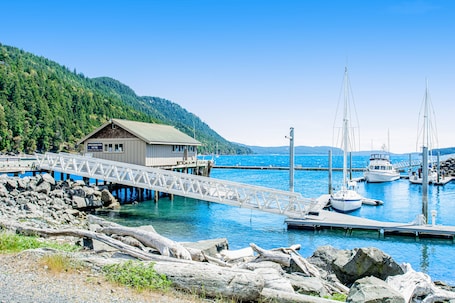 Marina. Wonderful escape with water access, three balconies, W/D, & gas fireplace