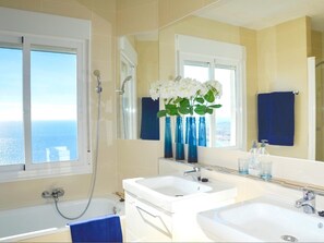 Bathtub, hair dryer, towels