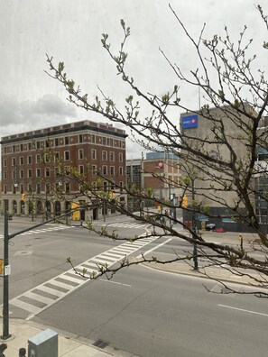 A street view with a building labeled "BMO" and a crosswalk. - Fully Furnished & Renovated Historic Condo in Downtown Core (London)