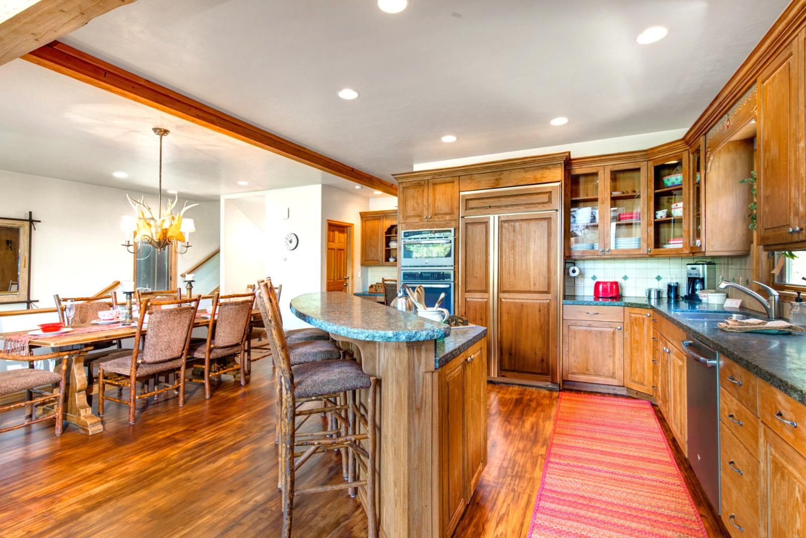 Kitchen layout supports large group meals and easy flow into the dining area.
