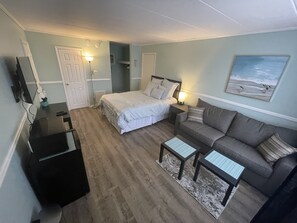 A room with a bed, a sofa, a desk, and a TV. - Home style,cozy room a block from the beach (Wildwood)