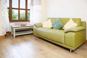 Leilighet, 1 queensize-seng | Oppholdsrom