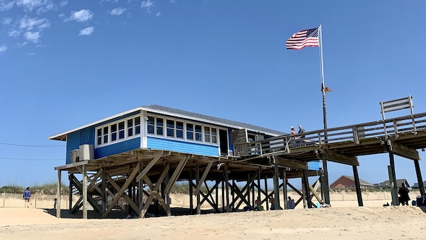 A beachside pier with a lifeguard station. - Soundside, 5 min walk to the beach, 6 private decks, shared pool and pickleball (Avon)
