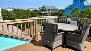 A wooden deck with wicker furniture and a pool. - Soundside, 5 min walk to the beach, 6 private decks, shared pool and pickleball (Avon)