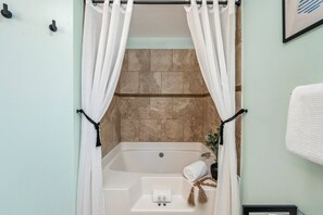 Combined shower/bathtub, hair dryer, towels, soap
