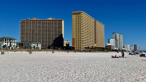 A beach with high-rise buildings in the background. - Luxury 3BD Calypso Gulf Views! Free Beach Chairs Service for 4 (Panama City Beach)