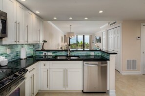 Fridge, microwave, oven, stovetop - Updated Beachfront Condo; Resort Amenities w/Heated Pool, Wifi & Beach Gear ~Walk to Dining & Shops (Marco Island)