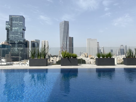 Outdoor pool, open 10:00 AM to 5:30 PM, pool umbrellas, pool loungers. Jo Hotel