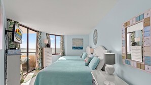 Une chambre avec deux lits, une commode, un miroir et une fenêtre donnant sur un paysage agréable.