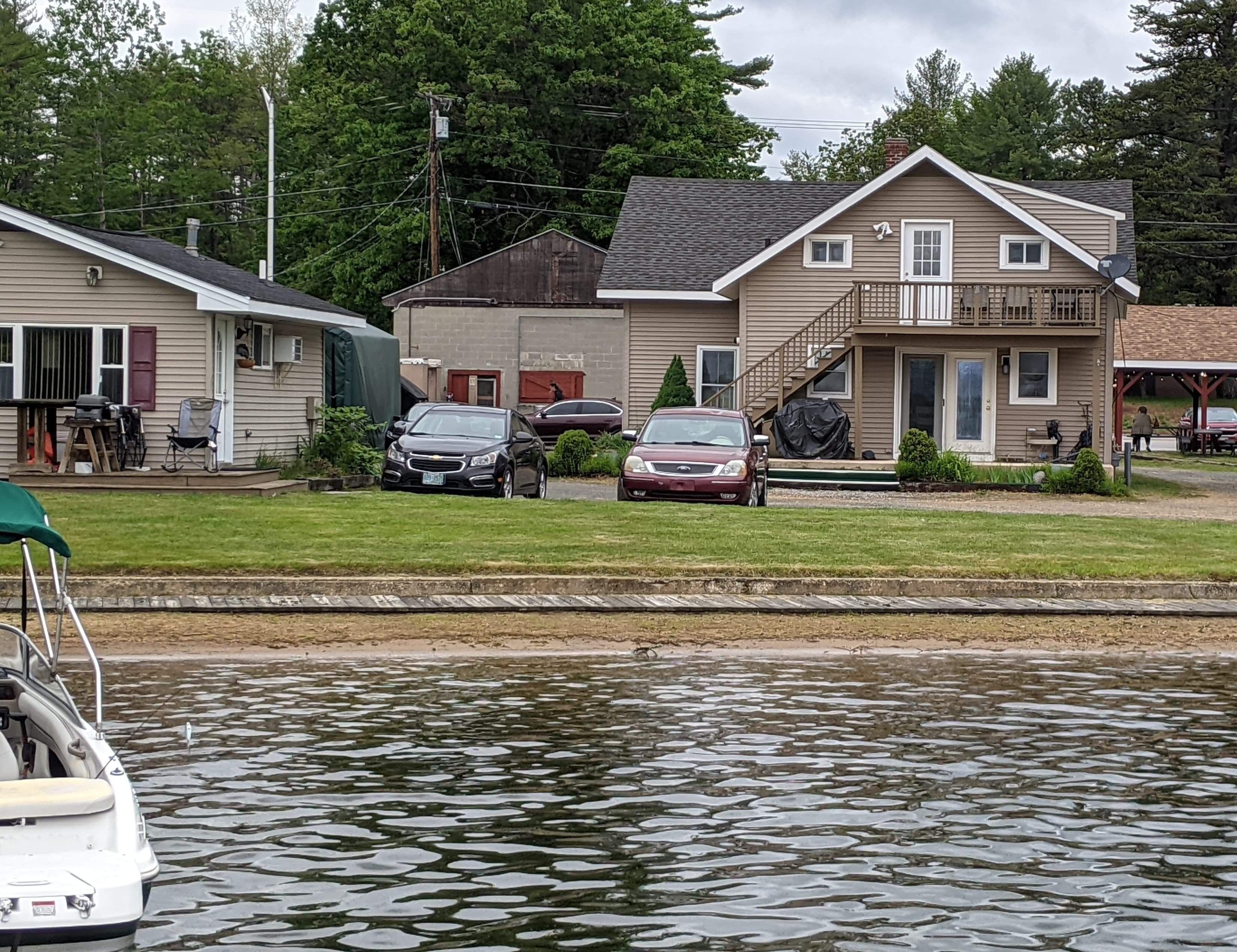 A house with a garage, a covered porch, and a small deck.