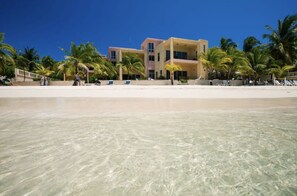 On the beach, sun-loungers - $3,000,000 Luxury Beach Front (4) Bedrooms Condo famous West Bay Beach Sleeps 8 (West Bay)