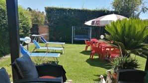 A patio area with outdoor furniture, a small pool, and a view of the backyard. - 3 Bedrooms Villa Sleeps 6 With Garden (Rome)