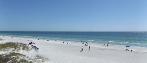 On the beach, sun-loungers, beach towels