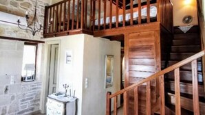A wooden staircase with a railing leading to an upper level. - Aelia Villa & Apartments with enchanting views of the Messara plain (Kamilari)