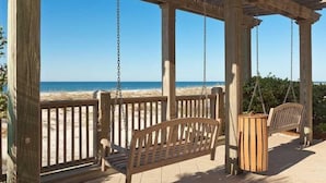 A wooden beach deck with a swing set and a bench overlooking the ocean. - Beach Club Resort. Book Your Summer Vacation Now! My Rates are Hard to Beat! (Gulf Shores)