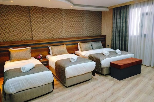 Premium bedding, free minibar items, in-room safe, desk