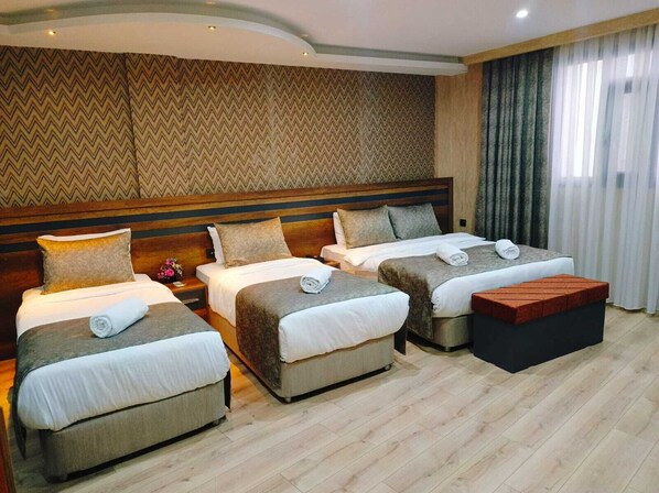 Premium bedding, free minibar items, in-room safe, desk