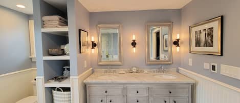 Bathtub, hair dryer, towels, soap