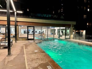 An indoor swimming pool with clear water, a changing room area, and a covered seating area. - Ski-In/Ski-Out Condo: Prime Main St. Location, Views (Breckenridge)