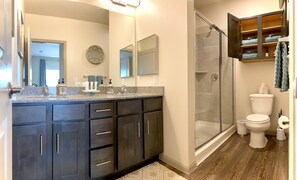 Combined shower/tub, hair dryer, towels, soap