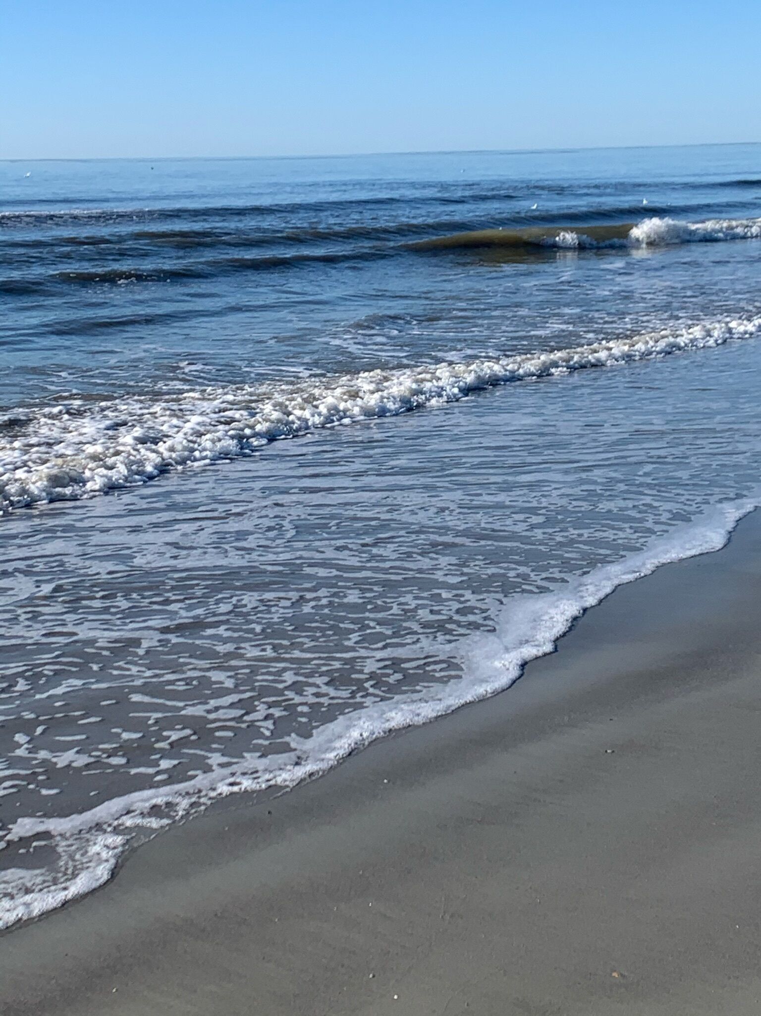 Nær stranden og solsenger
