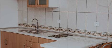 Fridge, microwave, stovetop, coffee/tea maker