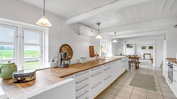 Coffee/tea maker, fridge, stovetop, dishwasher