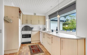 Fridge, stovetop, dishwasher, coffee/tea maker