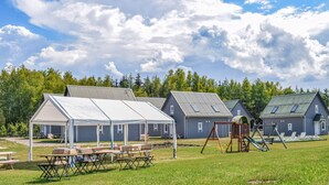 A campground with several cabins, picnic tables, and a playground. - Awesome home in Rewal with WiFi (Rewal)