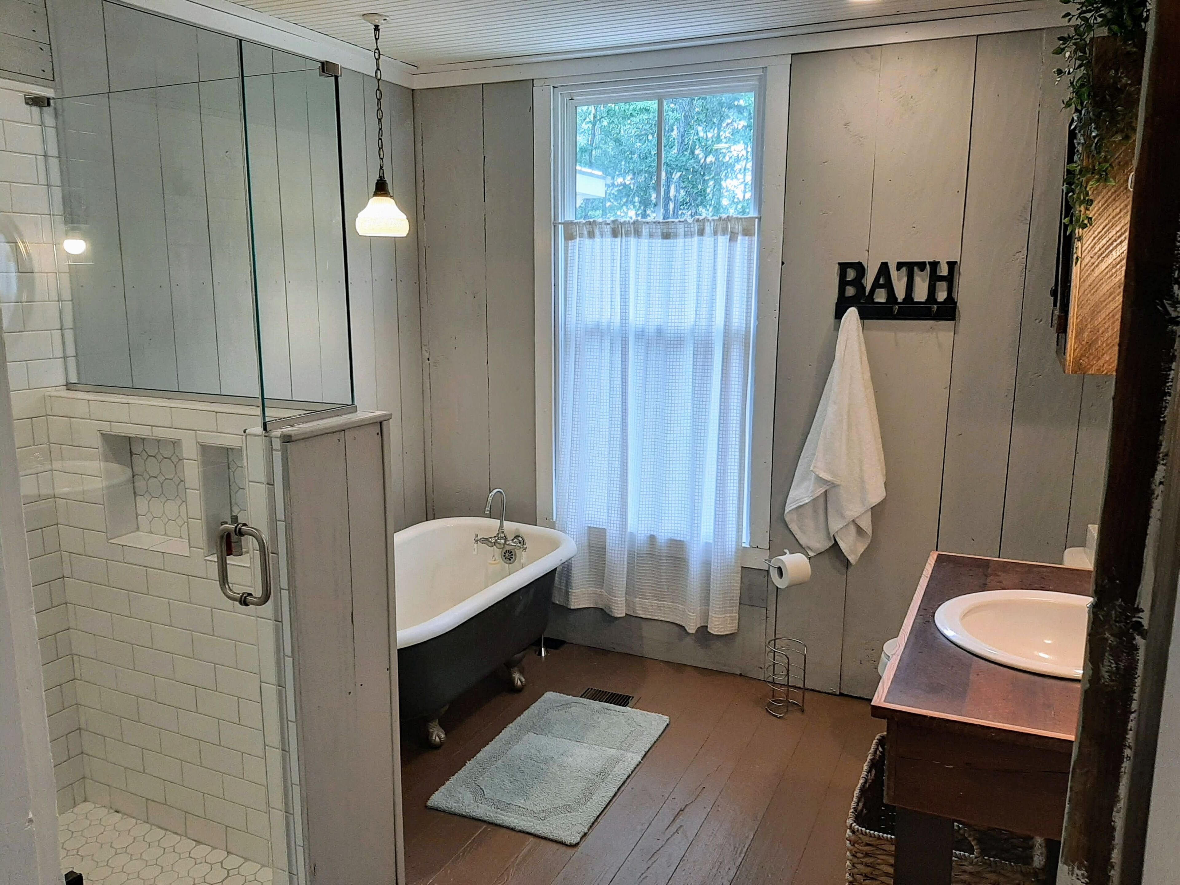Bathtub, hair dryer, towels, soap