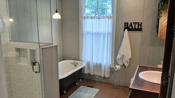 Bathtub, hair dryer, towels, soap