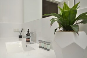 Bathtub, hair dryer, towels, soap