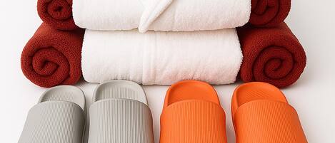 A stack of towels and slippers.