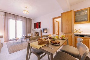 Enjoy a comfortable stay in this well-appointed living space with a dining area, sofa, and fully equipped kitchen.