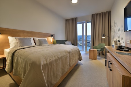 Minibar, in-room safe, desk, laptop workspace. Hotel Element Lipno