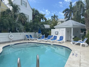 A heated pool, sun loungers