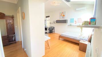 1 bedroom, desk, iron/ironing board, travel crib