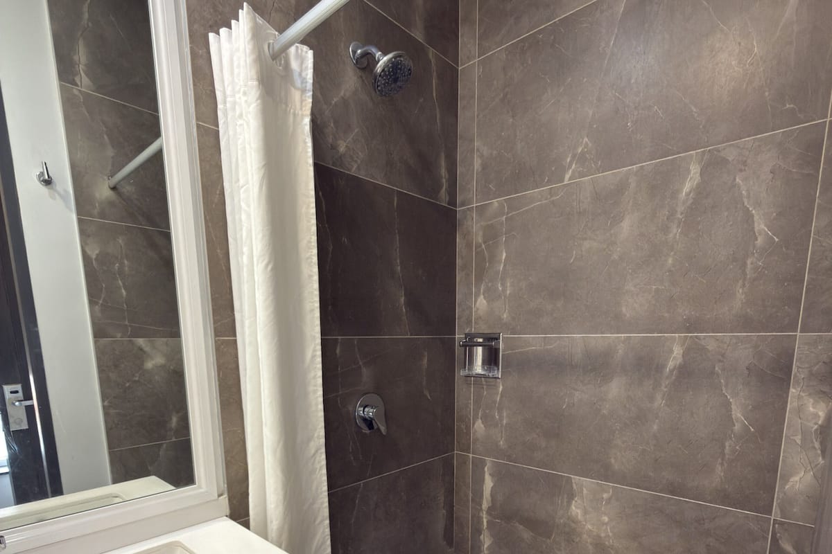 Shower, hair dryer, heated floors (bathroom), towels