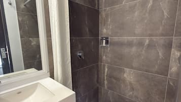 Shower, hair dryer, heated floors, towels