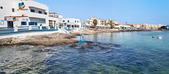 Vacation Home "Las Casitas 28" Near the Beach with Sea View, Pool, Wi-Fi & Terrace