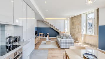 Deluxe Apartment, 1 Bedroom, City View | Living area | 43-inch LCD TV with cable channels, TV