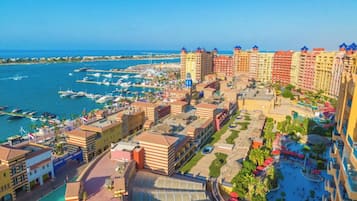 Enjoy the ocean views and tranquil courtyard with palm trees and outdoor seating areas.