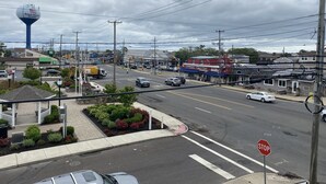 A street view with a stop sign, a TD Bank building, and a restaurant named 'The Conner's'.