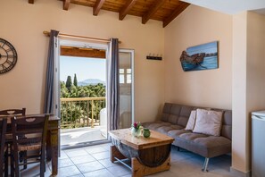 Superior Apartment, Hot Tub, Sea View | Living area | Flat-screen TV - Aloe Apartments with private Spa Tub by Konnect (Corfu)